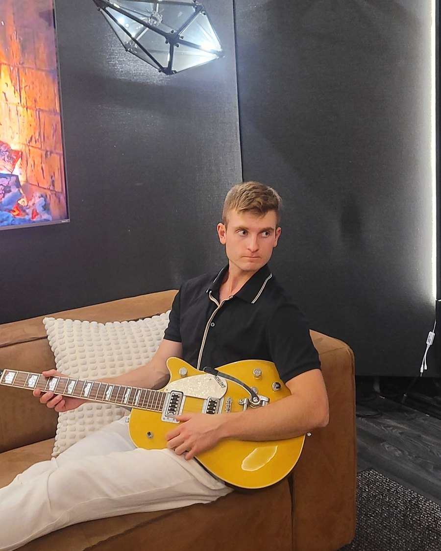 Dennis Ksendzov on the studio couch between takes