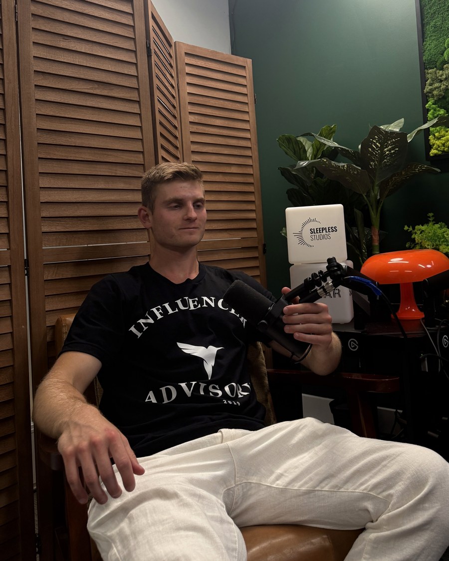 Dennis Ksendzov at the microphone on the podcast set